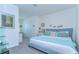 Bright bedroom with blue accents, carpet flooring, and ample natural light at 32960 Regent Canal St, Wesley Chapel, FL 33545