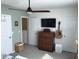 Bedroom featuring a ceiling fan, dresser, and guitar decor at 32960 Regent Canal St, Wesley Chapel, FL 33545