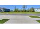 Street view of an empty lot ready for construction and landscaping at 32960 Regent Canal St, Wesley Chapel, FL 33545