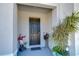 Cozy entryway featuring a decorative plant and welcoming front door at 32960 Regent Canal St, Wesley Chapel, FL 33545