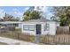 Charming home featuring a well-maintained front yard with a classic picket fence, new roof, and freshly painted exterior at 3620 E Shadowlawn Ave, Tampa, FL 33610