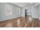 Bright living room with hardwood floors and large windows provides plenty of natural light and an open floor plan at 3620 E Shadowlawn Ave, Tampa, FL 33610