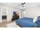 Bedroom featuring a blue bed, dark wood dresser, and neutral walls at 3633 S Renellie Dr, Tampa, FL 33629