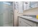 Cozy bathroom featuring a stand up shower and a white vanity with drawers and cabinets at 36936 Kay Ave, Zephyrhills, FL 33542