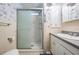 Cozy bathroom featuring a stand up shower and a white vanity with drawers and cabinets at 36936 Kay Ave, Zephyrhills, FL 33542