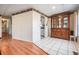 Bright dining room features a vintage hutch and tile flooring at 36936 Kay Ave, Zephyrhills, FL 33542