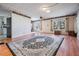 Open living room with wood floors and an open view to kitchen at 36936 Kay Ave, Zephyrhills, FL 33542