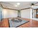 Spacious living room has wood floors and neutral wall colors at 36936 Kay Ave, Zephyrhills, FL 33542