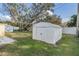 Large white storage shed located in the spacious backyard at 36936 Kay Ave, Zephyrhills, FL 33542