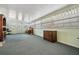 Sun room featuring gray carpet and lots of windows at 36936 Kay Ave, Zephyrhills, FL 33542