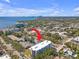 Wide aerial shot of the apartment building with a glimpse of Tampa Bay at 406 W Azeele St # 103, Tampa, FL 33606