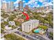 A view of the apartments including a swimming pool in front of the building at 406 W Azeele St # 103, Tampa, FL 33606