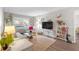Cozy living room with stylish decor, large window, and comfortable seating, perfect for relaxation and entertaining guests at 406 W Azeele St # 103, Tampa, FL 33606