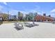 A sun-drenched community lounge area features plentiful seating and umbrellas at 406 W Azeele St # 103, Tampa, FL 33606