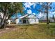 This home has a spacious back yard with fresh grass and trees at 4331 Kipling Ave, Plant City, FL 33566