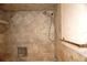 Bathroom with shower featuring stone tile and shower head at 4355 Tahitian Gardens Cir # D, Holiday, FL 34691