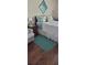 Comfortable bedroom with a wooden bed frame, soft bedding, and a calming color palette at 4355 Tahitian Gardens Cir # D, Holiday, FL 34691