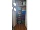 Organized closet with shelves, storage containers, and various household items neatly arranged at 4355 Tahitian Gardens Cir # D, Holiday, FL 34691
