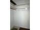 Walk-in closet with shelf and hooks at 4355 Tahitian Gardens Cir # D, Holiday, FL 34691