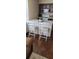 Kitchen island with seating and a white marble countertop providing additional dining space at 4355 Tahitian Gardens Cir # D, Holiday, FL 34691