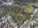 Stunning aerial view of a picturesque neighborhood with a mix of houses, connected by walking trails and surrounded by nature at 45 Gulfwinds W Dr, Palm Harbor, FL 34683