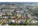 An aerial view of a waterfront community with private docks and lush landscaping at 45 Gulfwinds W Dr, Palm Harbor, FL 34683