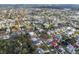 Expansive aerial shot showcasing a neighborhood's waterfront homes with canals, lush greenery, and serene waterways at 45 Gulfwinds W Dr, Palm Harbor, FL 34683