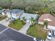 An aerial view shows this neighborhood with mature trees and the proximity to nearby waterways at 45 Gulfwinds W Dr, Palm Harbor, FL 34683