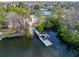 Beautiful aerial view of the community boat launch, set near lush trees and waterways at 45 Gulfwinds W Dr, Palm Harbor, FL 34683