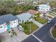 Charming single-story home with a well-maintained lawn, mature landscaping, and a driveway with a boat at 45 Gulfwinds W Dr, Palm Harbor, FL 34683