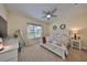 Comfortable bedroom with natural light, carpet floors, and a ceiling fan at 4524 Deep Creek Ter, Parrish, FL 34219