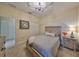 Bedroom featuring a bed with natural light, carpet floors, and a ceiling fan at 4524 Deep Creek Ter, Parrish, FL 34219