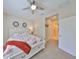 Bright bedroom with a view to the hallway and carpeted floors at 4524 Deep Creek Ter, Parrish, FL 34219