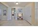 Elegant foyer with tile flooring, neutral paint, and decorative touches offering a warm welcome into the home at 4524 Deep Creek Ter, Parrish, FL 34219