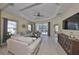 Bright living room featuring tile floors, neutral paint, and access to the lanai at 4524 Deep Creek Ter, Parrish, FL 34219