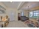 Inviting living room features a cozy seating area with a decorative rug and views of the neighborhood at 4524 Deep Creek Ter, Parrish, FL 34219