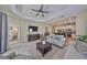 Open-concept living room featuring tile flooring, comfortable seating, and seamless connection to the kitchen at 4524 Deep Creek Ter, Parrish, FL 34219