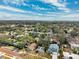 Scenic aerial view of a residential neighborhood with tree-lined streets and diverse home styles at 519 Roanoke St, Dunedin, FL 34698