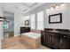Luxurious bathroom featuring a soaking tub, dual sinks and mirrors, and recessed lights at 5943 Jasper Glen Dr, Lithia, FL 33547