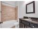 Updated bathroom featuring a tiled shower/bath combination and modern vanity at 5943 Jasper Glen Dr, Lithia, FL 33547