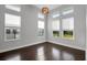 Bright bedroom features high ceilings, many windows, and gleaming wood floors at 5943 Jasper Glen Dr, Lithia, FL 33547
