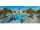 Wonderful community pool with water slide and splash pad in a beautiful tropical setting at 5943 Jasper Glen Dr, Lithia, FL 33547