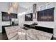 Gourmet kitchen with stainless steel appliances, a large center island, and pendant lighting at 5943 Jasper Glen Dr, Lithia, FL 33547