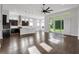 Bright, open-concept living space with a modern kitchen and large glass doors leading to the backyard at 5943 Jasper Glen Dr, Lithia, FL 33547