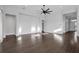 Expansive living room features dark hardwood floors, recessed lighting, and ample space for entertaining at 5943 Jasper Glen Dr, Lithia, FL 33547