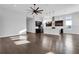 Open-concept living space with hardwood floors seamlessly connects the living area and gourmet kitchen at 5943 Jasper Glen Dr, Lithia, FL 33547