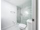 Bathroom with walk-in shower that features beautiful tile, modern fixtures and glass enclosure at 6233 Dewdrop Way # 6233, Tampa, FL 33617