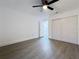 Bedroom showcasing new flooring, closet, and neutral walls at 6233 Dewdrop Way # 6233, Tampa, FL 33617
