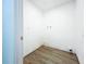 Bright laundry room features wood-look flooring and is ready for appliances at 6233 Dewdrop Way # 6233, Tampa, FL 33617