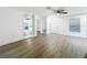 Bright living room with modern vinyl floors, neutral paint, and view to backyard at 6233 Dewdrop Way # 6233, Tampa, FL 33617
